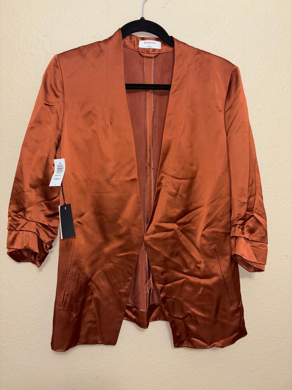 Aritzia Babaton satin blazer in a rich copper/rust color